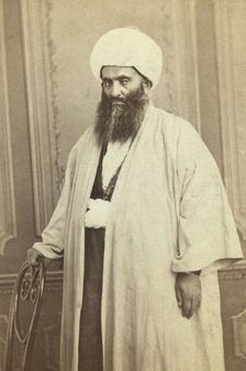 Three-quarters length portrait of a mullah(?), facing left, between 1870 and 1886. Creator: Unknown