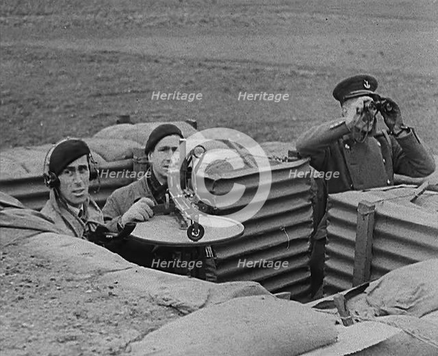 Three Royal Observer Corps Members in a Lookout Post, 1940. Creator: British Pathe Ltd.