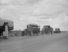 Three related drought refugee families from Oklahoma on highway near Lordsburg, New Mexico, 1937. Creator: Dorothea Lange