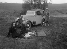 Three women having a picnic during a road test of a Triumph Scorpion, 1931. Artist: Bill Brunell