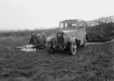 Three women having a picnic during a road test of a Triumph Scorpion, 1931. Artist: Bill Brunell