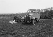 Three women having a picnic during a road test of a Triumph Scorpion, 1931. Artist: Bill Brunell
