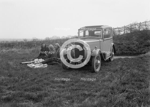 Three women having a picnic during a road test of a Triumph Scorpion, 1931. Artist: Bill Brunell.