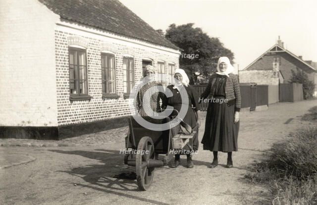 Three women on their way to town to sell fish their husbands have caught, Landskrona, Sweden. Artist: Unknown