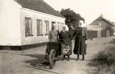 Three women on their way to town to sell fish their husbands have caught, Landskrona, Sweden. Creator: Unknown