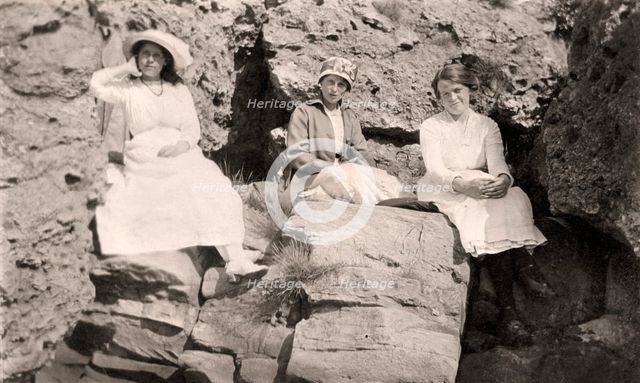 Three women relaxing on rocks, early 20th century. Artist: Unknown