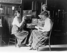 Three women work at the card index files at the headquarters of the National Woman's Party, c.1920