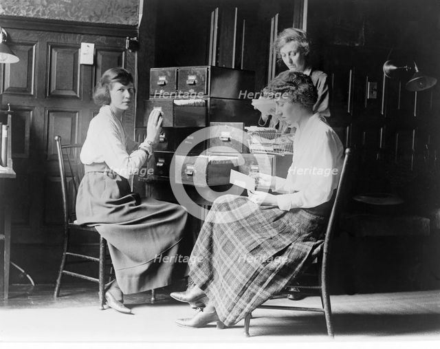 Three women work at the card index files at the headquarters of the National Woman's Party, c.1920.