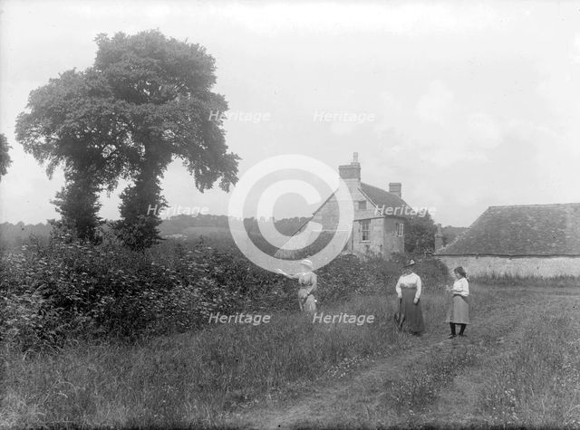 Three women walk through the countryside near Brasenose Farm, Oxford, Oxfordshire, c1860-c1922. Artist: Henry Taunt