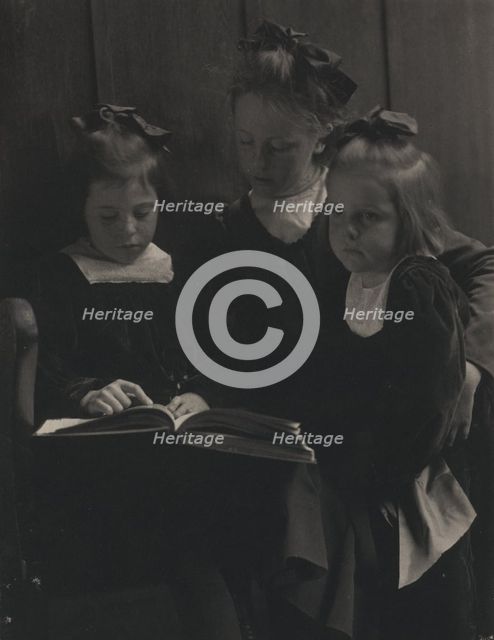 Three young girls reading a book, c1900. Creator: Gertrude Kasebier.