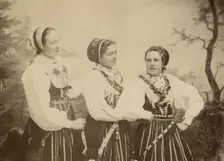 Three young women dressed in costumes from Leksand, Dalarna, 1886-1920. Creator: Helene Edlund