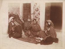 Three young women sitting by a doorway, Tunis, c1910. Ernst Heinrich Landrock, (1878-1966) Creator: Lehnert & Landrock