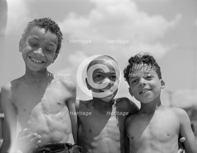 Three youngsters, Frederick Douglass housing project, Anacostia, D.C., 1942. Creator: Gordon Parks.