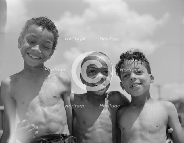 Three youngsters, Frederick Douglass housing project, Anacostia, D.C., 1942. Creator: Gordon Parks.