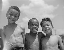 Three youngsters, Frederick Douglass housing project, Anacostia, D.C., 1942. Creator: Gordon Parks