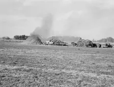Threshing red clover for seed on older settler's ranch, near Ontario, Oregon, 1939. Creator: Dorothea Lange