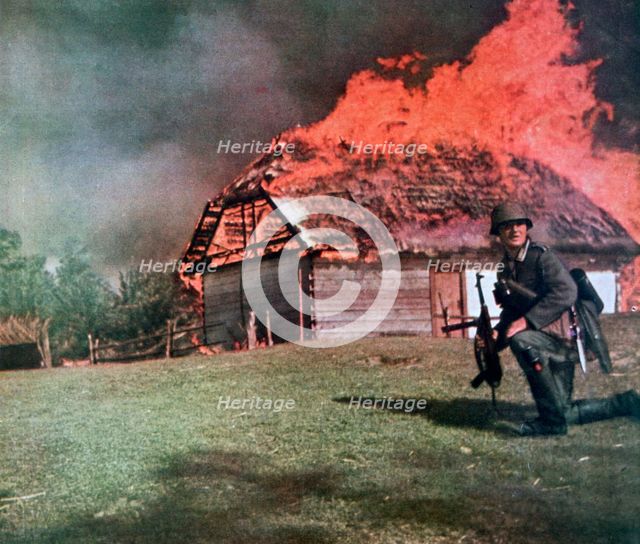 'Through the curtain of flame German observers move forward', Russia, 1941. Artist: Unknown