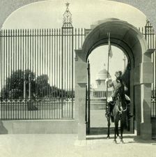 Through a Sentry-guarded Gateway to the Beautiful Government Buildings of New Delhi c1930s. Creator: Unknown