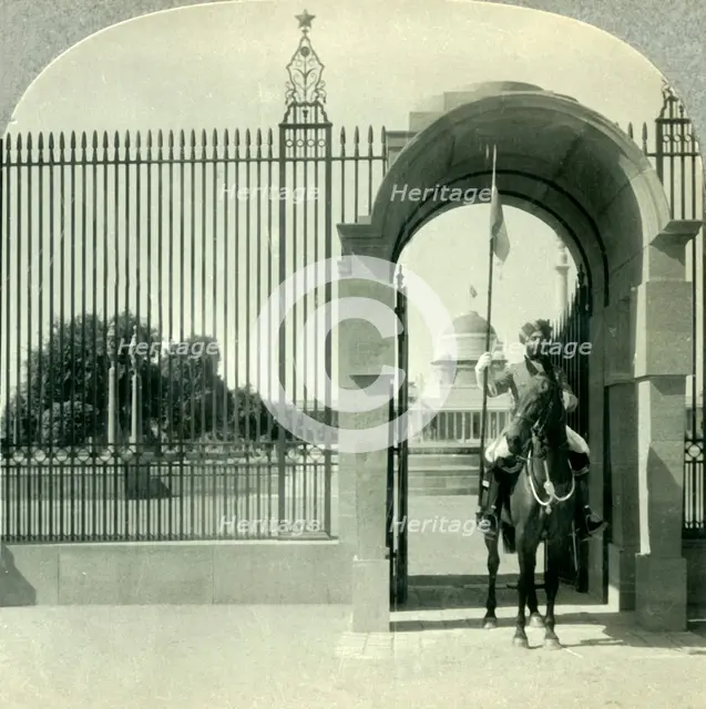 'Through a Sentry-guarded Gateway to the Beautiful Government Buildings of New Delhi', c1930s. Creator: Unknown.