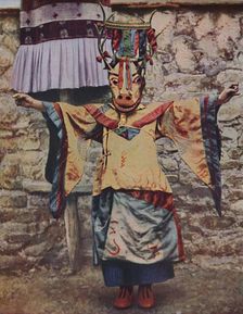 Tibetan lama attired for the devil dance c1935
