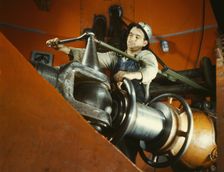 Tightening a nut on a guide vane operating seromotor in TVA's..., Watts Bar Dam, Tennessee, 1942. Creator: Alfred T Palmer