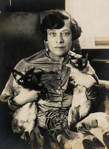Tilla Durieux with two Siamese cats, 1920s. Creator: Stone, Sasha (1895-1940)