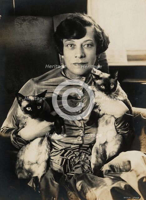 Tilla Durieux with two Siamese cats, 1920s. Creator: Stone, Sasha (1895-1940).