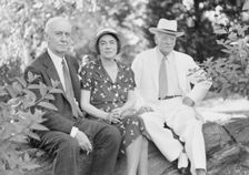 Timken, W.R., Mr. and Mrs., and John Hemming Fry, seated outdoors, 1938 July. Creator: Arnold Genthe