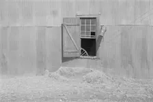 Tin wall of the cotton gin building, Vicinity of Moundville, Alabama, 1936. Creator: Walker Evans