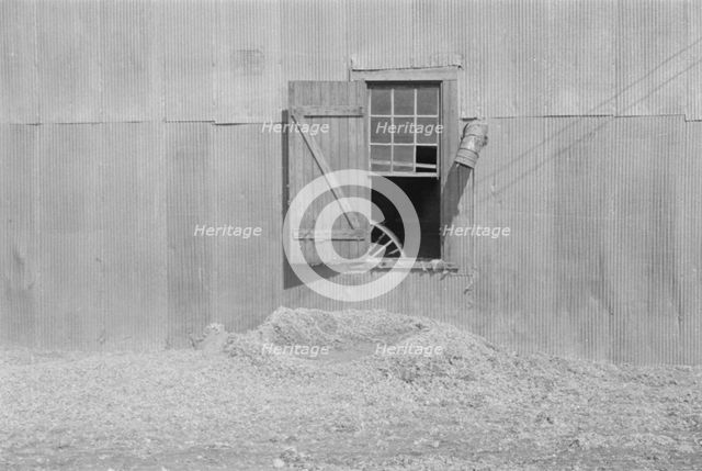 Tin wall of the cotton gin building, Vicinity of Moundville, Alabama, 1936. Creator: Walker Evans.