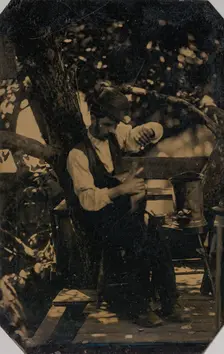 Tinsmith Working Under a Tree, 1870s. Creator: Unknown
