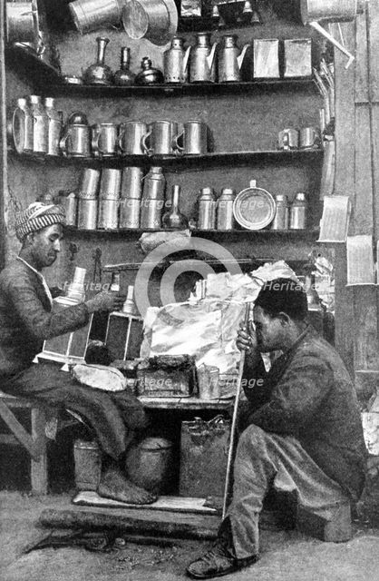 Tinsmiths in a tinsmith's shop, India, 1922.Artist: R Gorbold