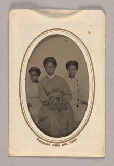 Tintype in a paper case of three unidentified young women seated, 1870s. Creator: Unknown