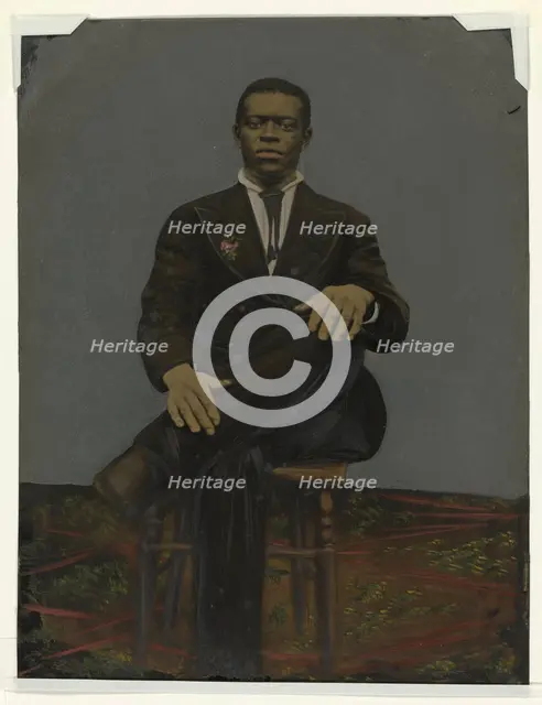 Tintype of a man wearing a suit with a pendant on the lapel, early 20th century. Creator: Unknown.
