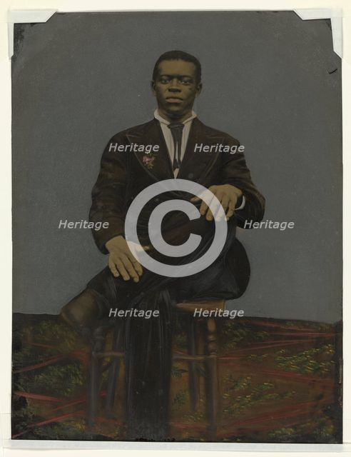 Tintype of a man wearing a suit with a pendant on the lapel, early 20th century. Creator: Unknown.