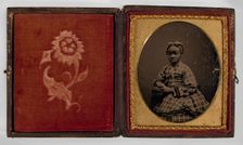 Tintype of a girl in a plaid dress, 1870s. Creator: Unknown