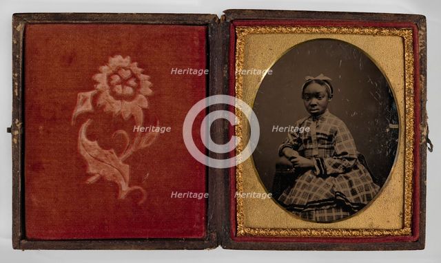 Tintype of a girl in a plaid dress, 1870s. Creator: Unknown.