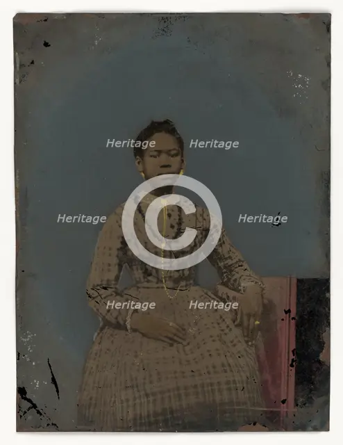 Tintype of a seated young woman, 1850-1875. Creator: Unknown.