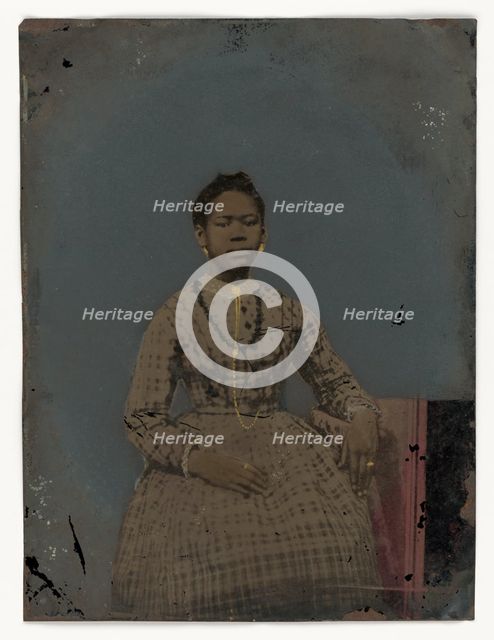 Tintype of a seated young woman, 1850-1875. Creator: Unknown.