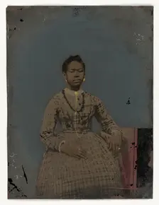 Tintype of a seated young woman, 1850-1875. Creator: Unknown