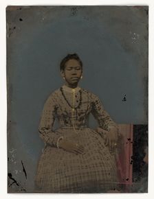 Tintype of a seated young woman, 1850-1875. Creator: Unknown