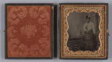 Tintype of a woman wearing a white hat and holding a book, 1880s. Creator: Unknown