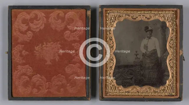 Tintype of a woman wearing a white hat and holding a book, 1880s. Creator: Unknown.