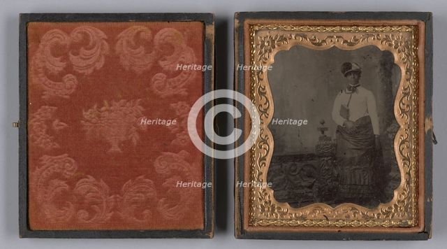 Tintype of a woman wearing a white hat and holding a book, 1880s. Creator: Unknown.