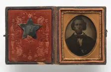 Tintype of Creed Miller with star-shaped military identification pin, 1864. Creator: Unknown