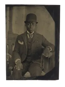 Tintype of man in suit, tie, and hat, after 1860s. Creator: Unknown
