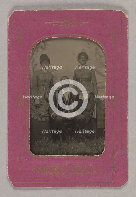 Tintype photograph of a man identified as James Turner, with two women, ca. 1873. Creator: H.G. Pearce.