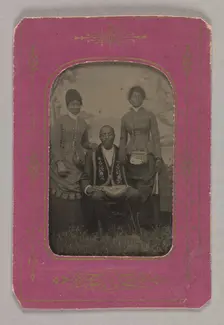 Tintype photograph of a man identified as James Turner, with two women, ca. 1873. Creator: H.G. Pearce