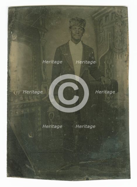 Tintype portrait of a man wearing a fur hat, late 19th century. Creator: Unknown.