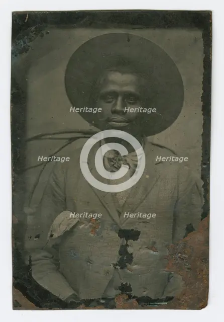 Tintype portrait of a man wearing a hat and suit, late 19th century. Creator: Unknown.